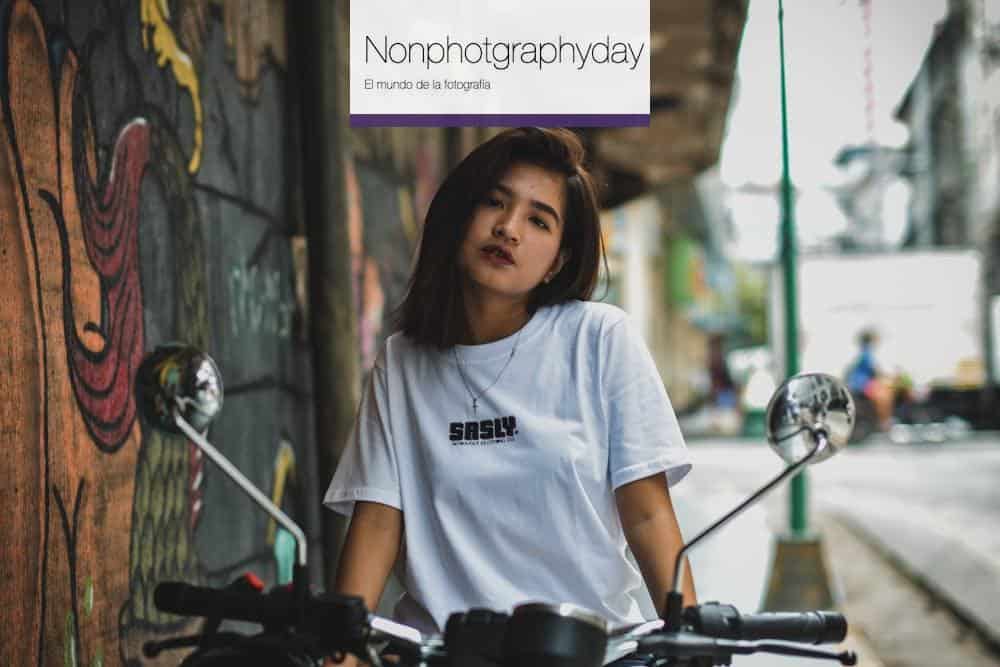 Woman Sitting on Motorcycle Parked Beside the Road